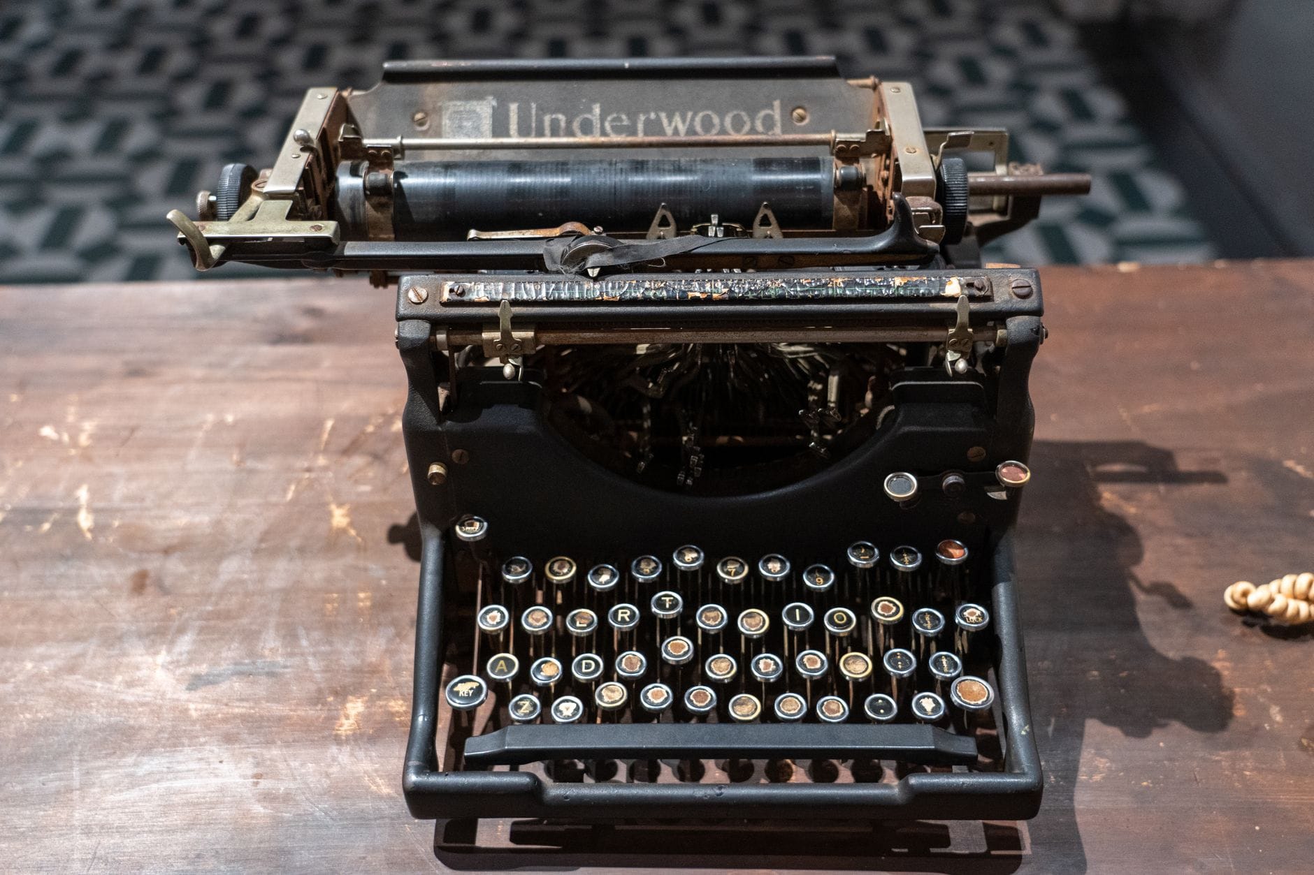 Top-down view of a classic Underwood typewriter on a wooden desk.